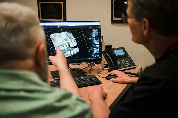 Dr. Johnson showing an xray to a patient