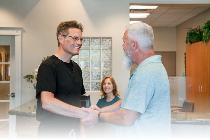 patient shaking doctors hand