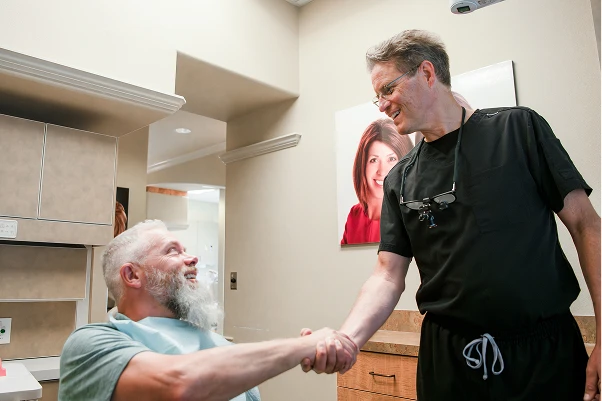 Dr. Johnson shaking a patient's hand