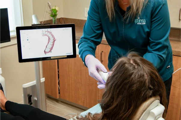 A patient getting their teeth scanned