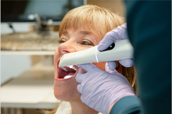 A patient getting their teeth scanned