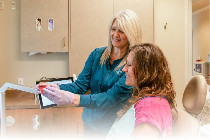 Patient being shown a model of teeth